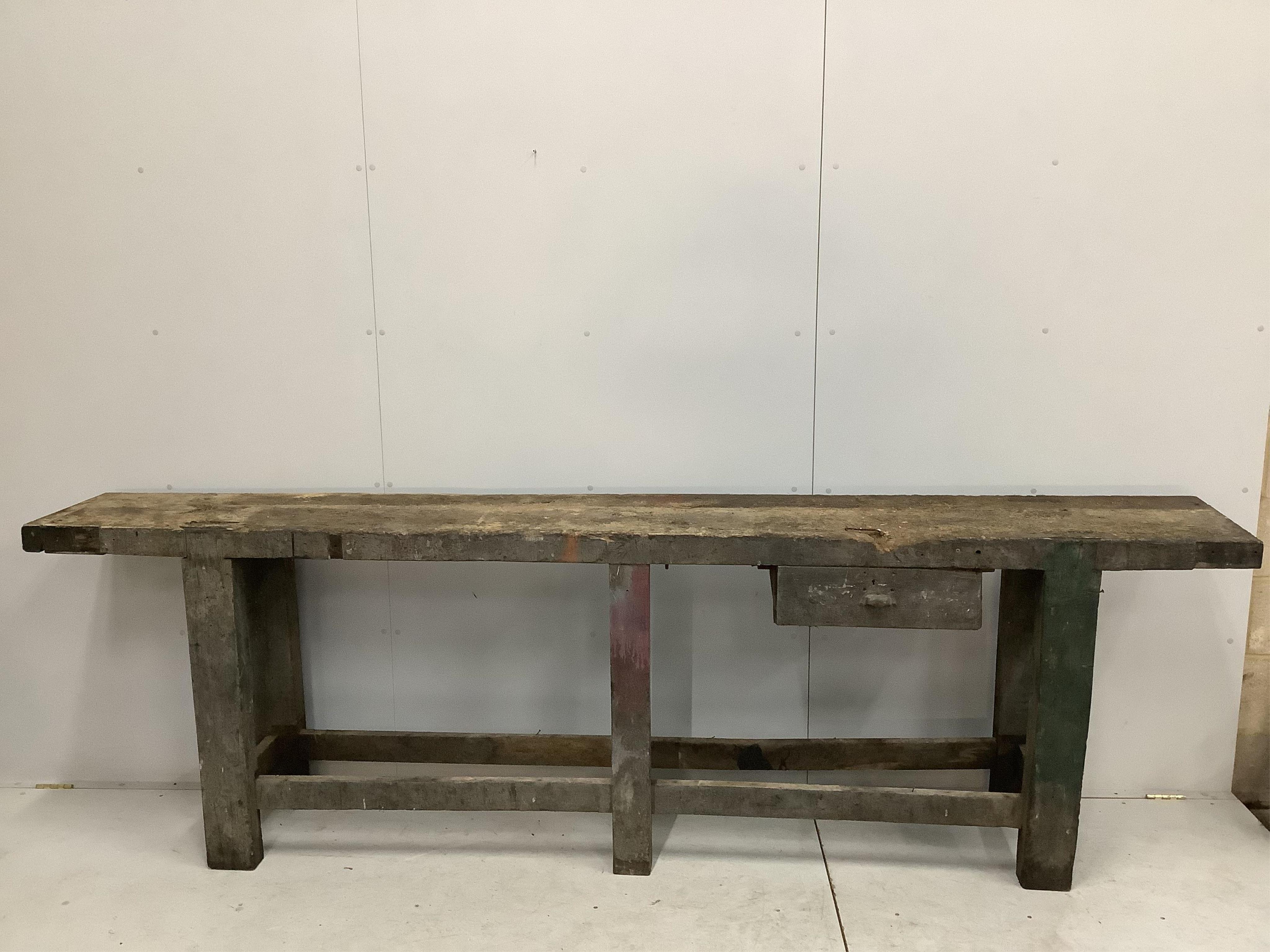 A 19th century Provincial work bench, fitted drawer, width 295cm, depth 40cm, height 90cm. Condition - poor